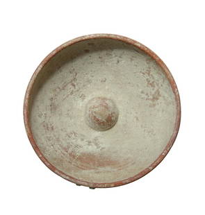 A nice Greek phiale or omphalos bowl: A nice Greek phiale or omphalos bowl, c. 4th- 3rd Century BC, decorated with three parallel bands in red slip, central circular raised area with opposing depression on the base, two holes for suspensi