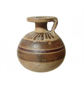 A nice Etrusco-Corinthian aryballos: A nice Etrusco-Corinthian aryballos, 7th Century BC, the rounded body decorated with bands of dark brown slip, vertical tongues around the shoulder. The neck is short with wide, flat rim decorated