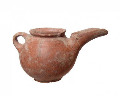 A Near Eastern red burnished spouted vessel: A Near Eastern red burnished spouted vessel, c. 1000 - 600 BC, the rounded body with ring foot, loop handle and long channel spout. The red-orange surface with nice vertical burnishing. 3 1/2 x 6 1/2