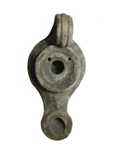 An attractive Hellenistic round-nozzled ceramic lamp: An attractive Hellenistic round-nozzled ceramic lamp, 2nd - 1st Century BC, a type known to have been manufactured at Ephesus. Of graceful style, the fill-hole is bordered by a ledge and the