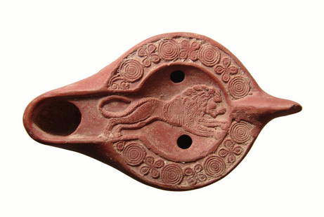 A choice Roman orange-ware lamp with leaping lion: A choice Roman orange-ware lamp with leaping lion, North African, 5th - 6th Century AD, the lion within central discus extremely well-detailed in fine style, fill-holes above and below, the rim