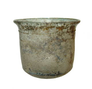 A beautiful Roman glass cup, 1st Century AD: A beautiful Roman glass cup, 1st Century AD, in near colorless glass, the vessel is beautifully formed with indented bottom, near vertical walls with flared mouth and rounded rim. On the outside just