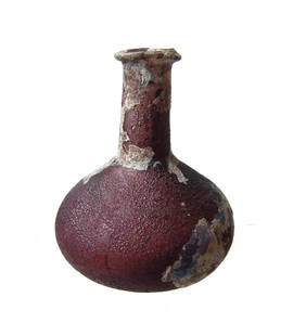 A lovely Roman aubergine glass perfume bottle: A lovely Roman aubergine glass perfume bottle, Eastern Mediterranean, 1st - 2nd Century AD, the squat body with lightly flattened bottom, vertical neck with mildly flared mouth and rolled rim. Nice