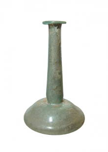 A choice Roman candlestick unguentarium: A choice Roman candlestick unguentarium, Eastern Mediterranean, 2nd - 3rd Century AD, the wide, bell-shaped body with lightly indented bottom, the long cylindrical neck is constricted at base, the