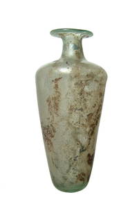 An attractive Roman pale blue-green glass bottle: An attractive Roman pale blue-green glass bottle, Eastern Mediterranean, 3rd - 4th Century AD, the body long and tapered with lightly flattened bottom. The shoulders are rounded with short