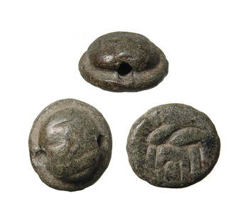 A green serpentine stone stamp seal: A green serpentine stone stamp seal, Southern Anatolia, 3rd Millennium BC, circular in shape with central dome with horizontal drill for suspension; on base, a horned antelope with frond over