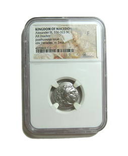 Silver coin of Alexander III (The Great) of Macedon: A silver coin of Alexander III 'The Great' of Macedon, 336-323 BC. Kingdom of Macedon, Alexander III 'The Great', 336-323 BC. Silver drachm. Head of Herakles right, clad in Nemean Lion-skin headdress