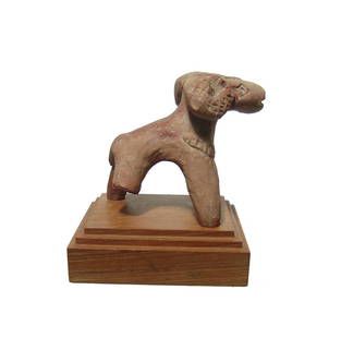 A detailed Indian terracotta figure of a ram: A detailed Indian terracotta figure of a ram, c. 1st Century BC - 2nd Century AD, hand-modeled with four tapered legs and a short tail. The head with long snout curled horns, with incised details and