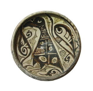 A lovely Nishapur glazed bowl: A lovely Nishapur glazed bowl, c. 10th Century AD, resting on a short foot with steep walls and inward angled rim. The interior is beautifully decorated with a large bird standing to left amidst