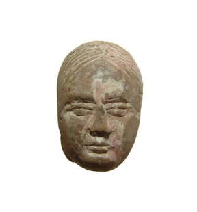 Chinese terracotta head of a woman, Han Dynasty: A Chinese terracotta head of a woman, Han Dynasty, 206 BC - AD 24, resembling the Yangling type terracottas, with detailed features and hair long and parted in the center. H: 2 in (5 cm). Nicely