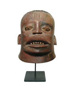 A Makonde initiation helmet mask (Lipico mask): A Makonde initiation helmet mask (Lipico mask), Tanzania, c. early 20th Century. Made of carved wood and decorated with carved tribal scarification. The head is decorated with real human hair. The