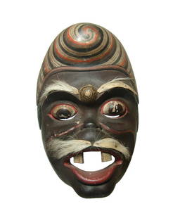 A nice antique Topeng mask, Java: A nice antique Topeng mask, Java, early - mid 20th Century, depicting a man with stylized hair or headdress and white mustache and eyebrows contrasting nicely with his dark skin, mouth open with