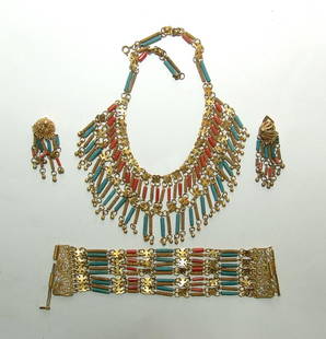 A set of antique Egyptian revival jewelry: A set of antique Egyptian revival jewelry. A lovely matching set which includes a necklace, bracelet and pair of clip earrings all constructed from gold plated brass with added antique Egyptian-style