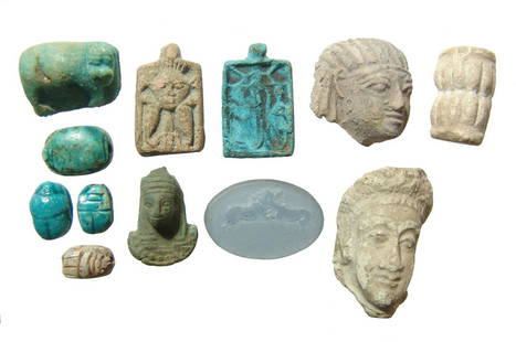 A group of 12 Egyptian replica tourist-type objects: A group of 12 Egyptian replica tourist-type objects. A nice mix of ceramic heads, one of depicting a pharaoh in Nemes head cloth, several plaques and glazed busts, a neat hippopotamus amulet, a mix