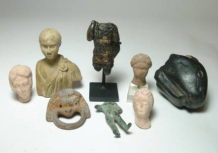 A group of 8 ancient-style replica objects: A group of 8 ancient-style replica objects. Lot includes a stone torso of a Roman emperor with a stand, a Roman style bust of a youth, three Greek-style terracotta heads, a Roman style bronze body of