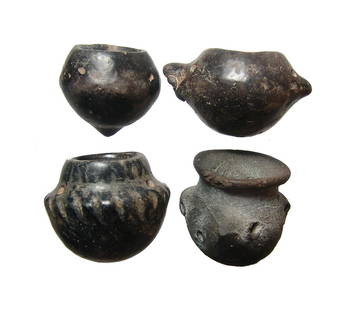 A lot of 4 Colima black-ware paint pots or votives: A lot of 4 Colima black-ware paint pots or votives, West Mexico, c. 100 BC - AD 250, one with a zoomorphic head and all pierced for hanging. Each with nice black surfaces. Three of the jars still