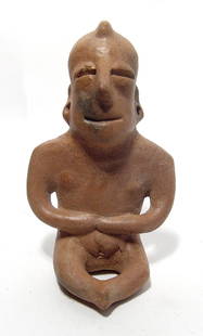 A nice Colima seated shaman figure: A nice Colima seated shaman figure, West Mexico, 100 BC - AD 250, with well modeled features, pierced ears and a small tuft of hair at center of head. H: 6 3/4 in (17.2 cm). Well preserved with a