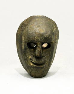 A rare shamanic ritual object: A rare shamanic ritual object, Guatemala. This maskette is 1 3/4 in (4.4 cm) high and has hollow eyes that retain translucent mother-of-pearl inlays. Lovely polished patina. Ex Drapkin collection.