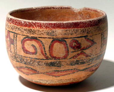 A fine Maya polychrome bowl: A fine Maya polychrome bowl, Peten region, Guatemala, c. AD 400 - 700, decorated with a pair of stylized monkeys, with their bodies in rounded form. They are separated by panels of Kan crosses. In