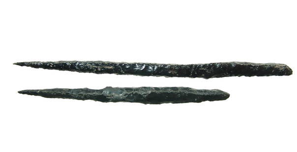 A pair of Mayan obsidian pointed blades: A pair of Mayan obsidian pointed blades, c. AD 400 - 700, each nicely knapped with nearly square profile tapering to a point, the opposite end more rounded. L: 9 5/8 in (24.3 cm) & 7 in (17.7 cm).