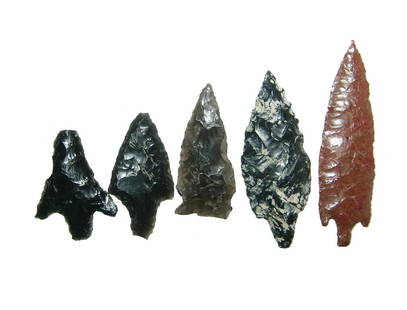 A group of 5 obsidian arrowheads: A group of 5 obsidian arrowheads, Mexico, four in a black obsidian are from Teotihuacan, Mexico, c. AD 400 - 700, and the last in mahogany obsidian, Colima, West Mexico, c. 100 BC - AD 250. Largest 3