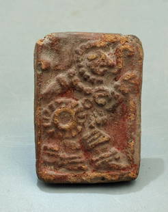 A choice ceramic Teotihuacan stamp: A choice ceramic Teotihuacan stamp, Mexico, c. 400 - 650 AD. This superbly detailed flat stamp is 2 inches long and depicts an ornately attired warrior carrying shield and club, with a speech scroll e