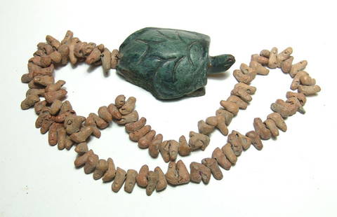 Costa Rican stone turtle pendant with terracotta beads: A nice Costa Rican green stone turtle pendant with terracotta beads, c. AD 1000 - 1450, the turtle nicely carved with incised detail, the beads hand-modeled in the form of fingers or toes, each with