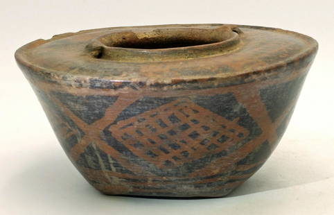 A large Narino vessel with black on red design: A large Narino vessel, Colombia, c. AD 850 - 1500. This rare example from the Capuli cultural complex is elaborately decorated with the characteristic black-on-red resist painted designs with an unusu