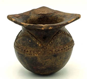 A rare San Augustin jar with squared rim: A rare San Augustin jar, Colombia, c. 600 - 100 BC, a fine Horqueta example featuring a squared rim, as well as intricate applique decor. H: 3 1/2 in (8.9 cm). Nicely burnished, strong mineral