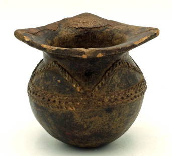 A rare San Augustin jar with squared rim: A rare San Augustin jar, Colombia, c. 600 - 100 BC, a fine Horqueta example featuring a squared rim, as well as intricate applique decor. H: 3 1/2 in (8.9 cm). Nicely burnished, strong mineral deposit