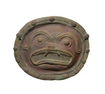 A lovely Jama-coaque ceramic jaguar maskette: A lovely Jama-coaque ceramic jaguar maskette, Ecuador, c. 200 BC - AD 500, with open mouth revealing teeth, large eyes and curved brow. The mask is bordered with two ridges and pellets and painted in