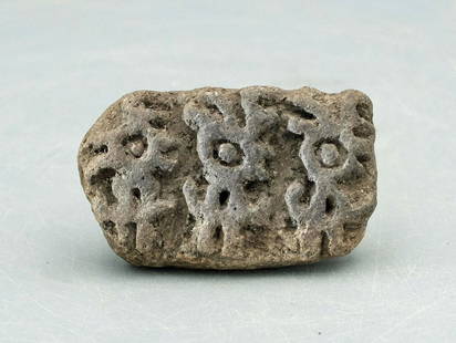 Excellent LaTolita stamp with trio of mythological: An excellent LaTolita stamp, Ecuador, c. 300 BC - AD 600, the base depicting a trio of mythological zoomorphic characters with prominent eyes. W: 2 in (5 cm). Good mineral deposits. Ex Virginia