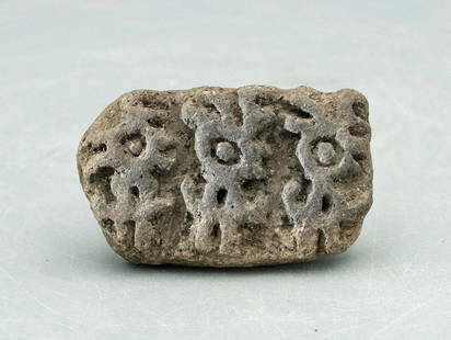 Excellent LaTolita stamp with trio of mythological: An excellent LaTolita stamp, Ecuador, c. 300 BC - AD 600, the base depicting a trio of mythological zoomorphic characters with prominent eyes. W: 2 in (5 cm). Good mineral deposits. Ex Virginia privat