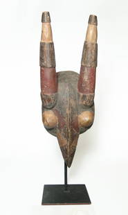 A handsome African wood mask, Mossi culture: A handsome African wood mask, Mossi culture, Burkina Faso, appearing to be in the form of a bird. The mask features two domed eyes with ridge running down the head and continuing onto the beak,