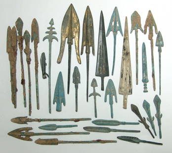 A large group of replica Chinese weapon points: A large group of replica Chinese weapon points. The balance are modern examples fashioned in ancient-style, but the two larger spear points are perhaps a bit older. Both are graceful types with
