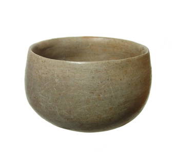 A Nayarit Post-Classic creme slipped bowl: A Nayarit Post-Classic creme slipped bowl, West Mexico, AD 900 - 1200, deep-walled with nicely burnished surfaces. 3 1/4 x 5 1/2 in (8.3 x 13.3 cm). Scattered deposits. Ex Petersen-Neubauer family
