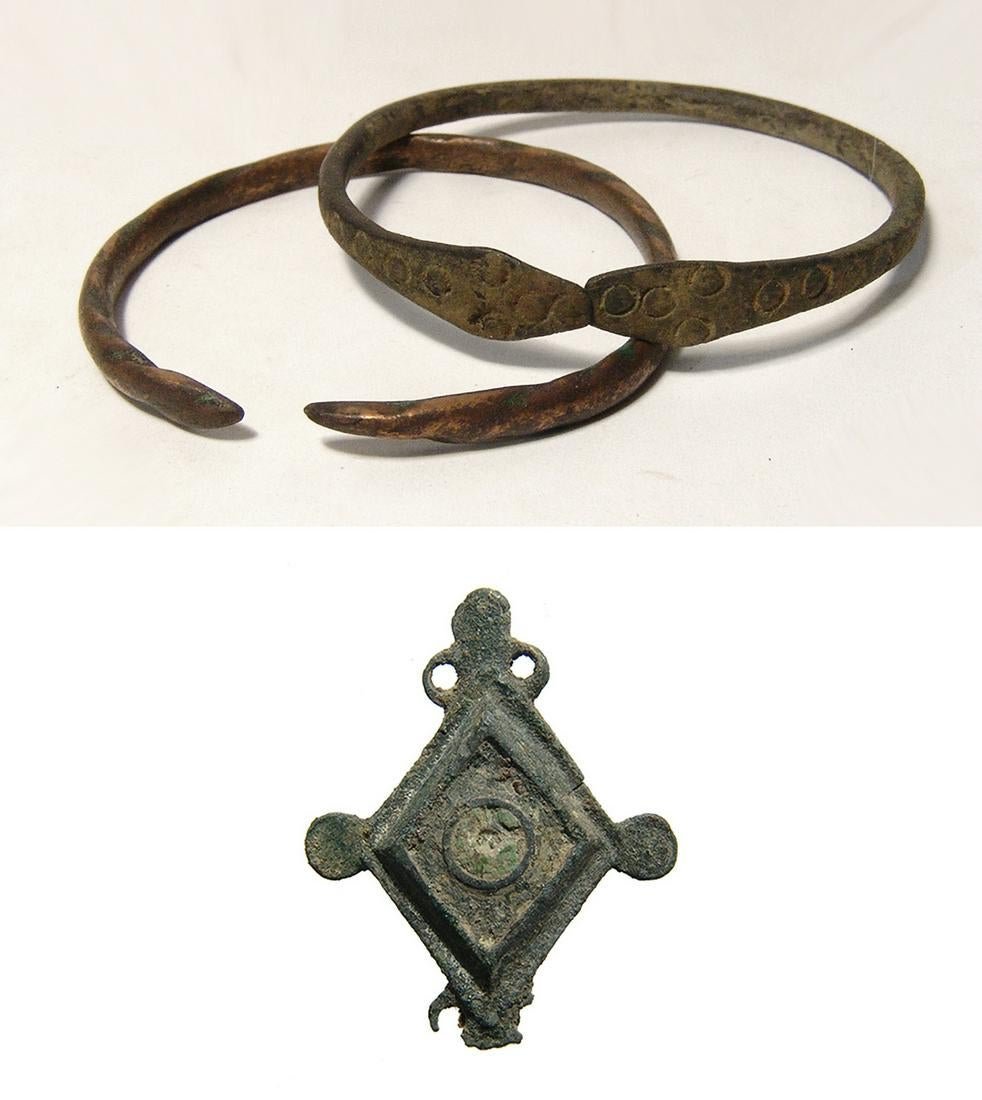 A pair of Western Asiatic bracelets and a Roman brooch (1 of 4)