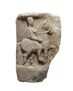 A handsome Romano-Thracian marble relief: A handsome Romano-Thracian marble relief depicting a horse and rider, 3rd - 4th Century AD, extremely well-preserved showing excellent detail in the rider's facial features, hair and clothing, the
