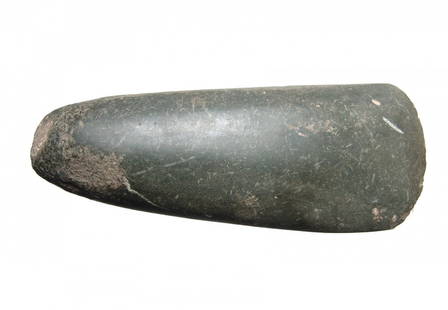 A large Neolithic green stone celt, Balkans: A large Neolithic green stone celt, Balkans, c. 5th - 4th Millennium BC, a substantial example with oval profile, polished sides and rounded cutting edge. Edges worked but unpolished, one side