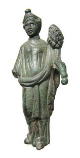 A fantastic Roman bronze figure of a goddess: A fantastic Roman bronze figure of a goddess, 1st - 2nd Century AD, wearing chiton and himation and holding a cornucopia, her hair styled in waves to the sides of a large pointed diadem and rolled