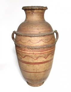 Large and attractive Berber terracotta transport vessel: A large and attractive Berber terracotta transport vessel, c. 19th Century - early 20th Century, creme-slipped with decoration in a red slip, two bands of ridging corresponding to the top and bottom
