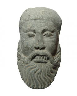 Interesting antique Chinese schist face of bearded man: An interesting antique Chinese schist face of a bearded man. Nicely carved with long beard and good style, the back side left unworked. 6 5/8 x 3 ¾ in. (16.8 x 9.5 cm).