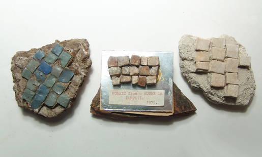 A group of 3 Roman mosaic fragments: A group of 3 Roman mosaic fragments, 1st - 2nd Century AD, the first contains green and blue glass tesserae still in situ, 4 5/8 x 3 in (11.7 x 7.5 cm), the second with large limestone tesserae in