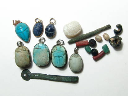 A nice group of 8 antique replica Egyptian scarabs: A nice group of 8 antique replica Egyptian scarabs. Seven with suspension loops and three with 12 carat gold bezels, two in sodalite and one appears to be turquoise. Also included is a group of