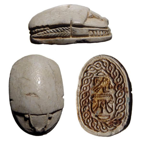 Egypt. 2nd Intermediate Period, c.1650 – 1549 BC. : Egypt. 2nd Intermediate Period, c.1650 – 1549 BC. Steatite. Detailed legs and well cut head with eyes. Base well cut with tight rope border encircling Horus falcon above 'ankh' and uraeii. 18x13mm.