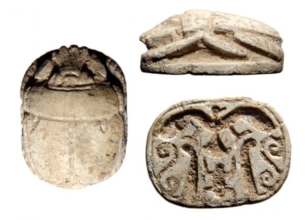 Egypt. New Kingdom, c.1549 – 1070 BC. Levantine. S: Egypt. New Kingdom, c.1549 – 1070 BC. Levantine. Steatite with traces of blue glaze. Nice scarab with symmetric base decorated with vulture with wings spread over 'kheper', feathers and spirals. 16x