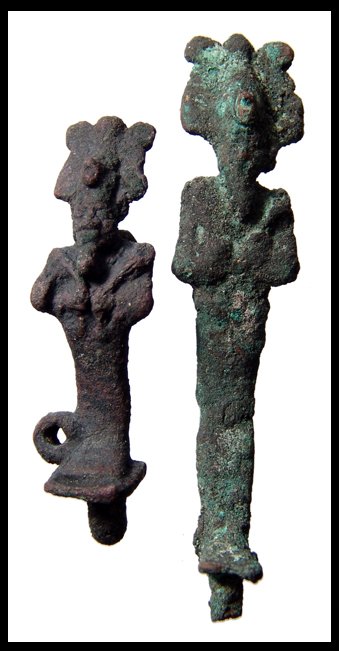 Pair of Egyptian bronze amulets of Osiris: A pair of bronze amulets of the god Osiris, each wearing the Atef crown and holding a crook and flail. Late Period, c.664 - 343 BC. Heights, 2 1/8" (5.5 cm) and 3" (7.6 cm). Ex Negus collection, UK, e