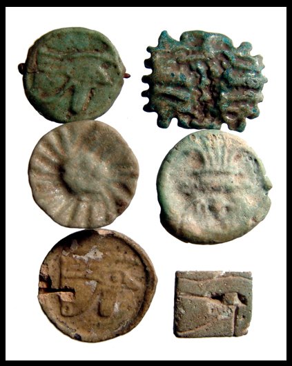 Lot of 6 amulets, plaques with Bes and a Wedjat: Lot of 6 faience amulets, Late Period, c.664 - 30 BC, including three plaques with Bes and a Wedjat. Sizes from 13mm to 21mm. Ex Negus collection, UK, early 20th century.