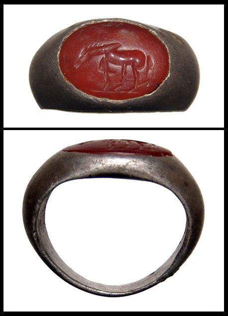 Roman silver ring with carnelian intaglio: A silver ring with carnelian intaglio, Roman, 2nd - 3rd Century AD, depicting a horse standing lt., lt. foreleg raised. Stone 14 x 11mm. Ring size about 5. Ex Los Angeles collection.
