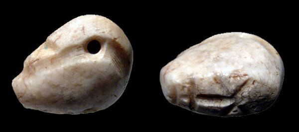 Neo-Babylonian, creme chalcedony duck seal: A creme chalcedony duck seal, Neo-Babylonian, c.6th - 7th Century BC, in typical style with head back over the body. On the base, a star upon an altar, symbol of Marduk. L: 21mm. In nice condition wit
